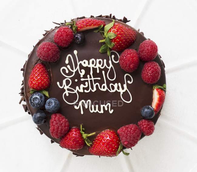 Birthday cake with chocolate glaze — Stock Photo