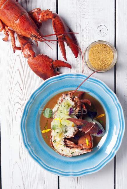 Top view of lobster Bisque with grilled lobster on wooden planks — Stock Photo