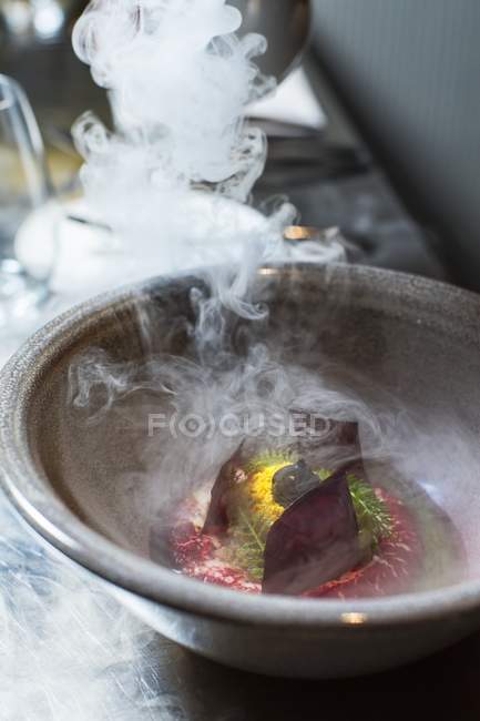 Beetroot on quark pure being made  in bowl with steam — Stock Photo