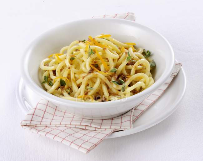 Troccoli pasta with anchovies and orange — Stock Photo