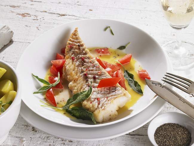 Cod in butter sauce — Stock Photo