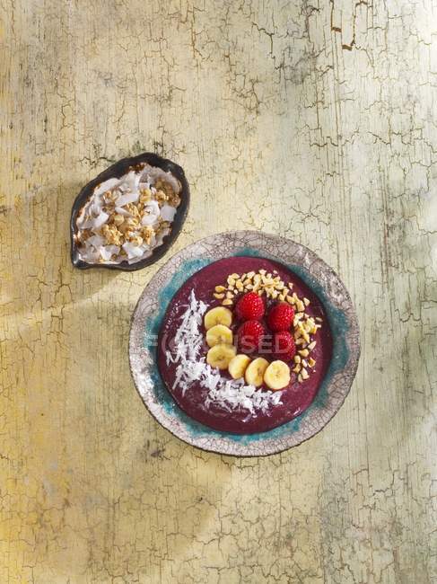 Muesli with Raspberries, coconuts and bananas — Stock Photo
