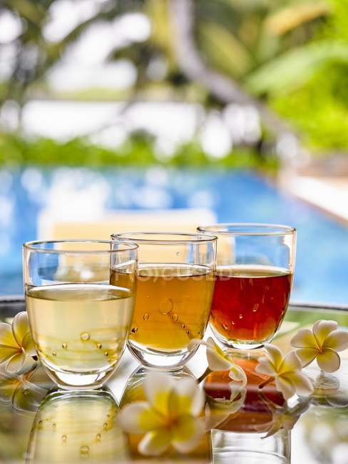 Various glasses of herb tea — Stock Photo