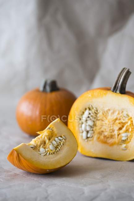 Pumpkins on white surface — Stock Photo