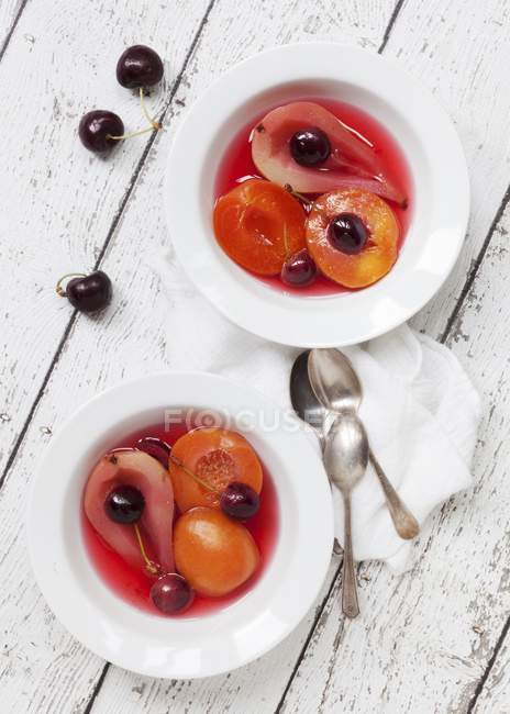 Closeup top view of poached fruit with vanilla — Stock Photo
