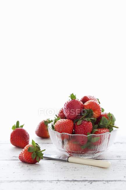 Fresh strawberries in glass dish — Stock Photo