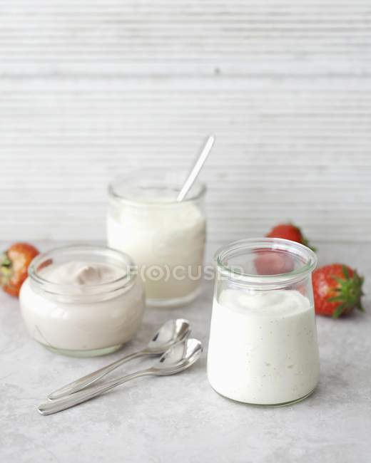 Organic flavored yogurts in glasses — Stock Photo