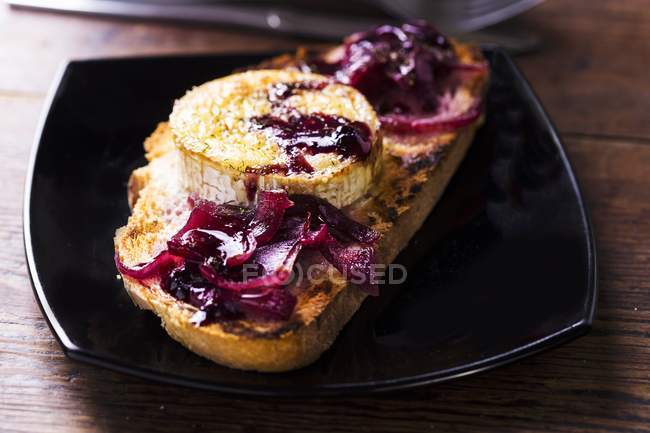 Grilled bread with onions — Stock Photo
