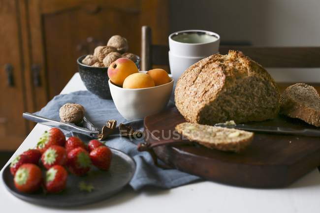 Breakfast table with bread — Stock Photo