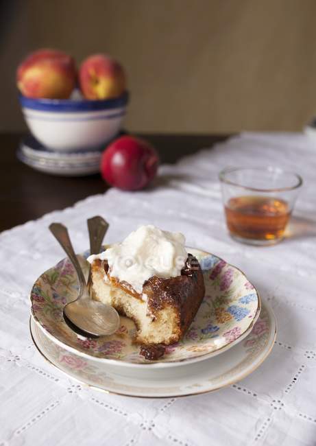 Peach upside down cake with cream — Stock Photo