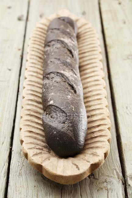 Baguette coloured with squid ink — Stock Photo