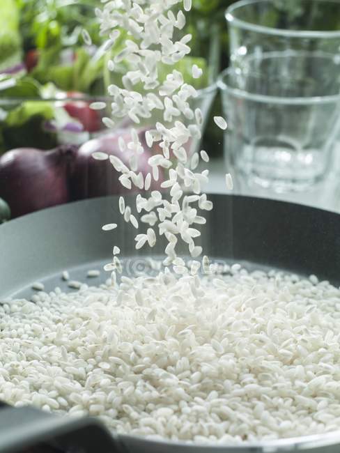 Risotto rice being sprinkled — Stock Photo