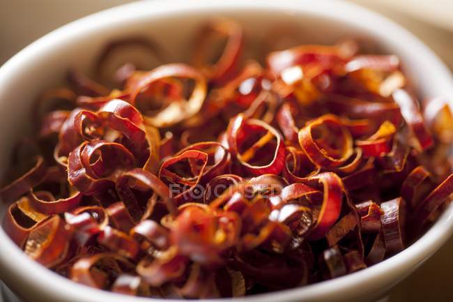 Dried chilli rings in a white bowl — Stock Photo