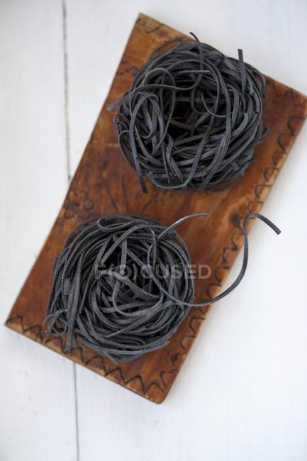 Pasta nests made of black sepia pasta — Stock Photo