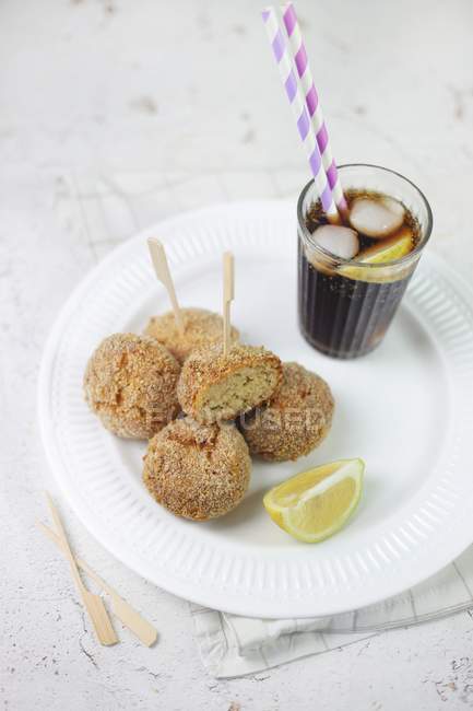 Polpetti and a glass of cola — Stock Photo