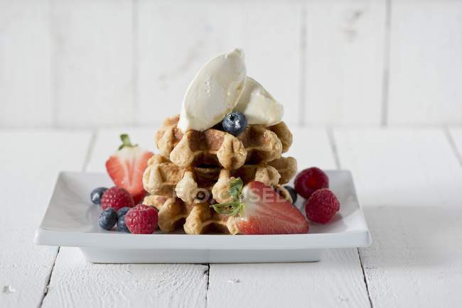 Waffles with mascarpone and berries — Stock Photo