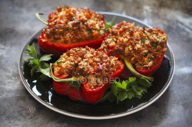 Red peppers filled with rice — Stock Photo
