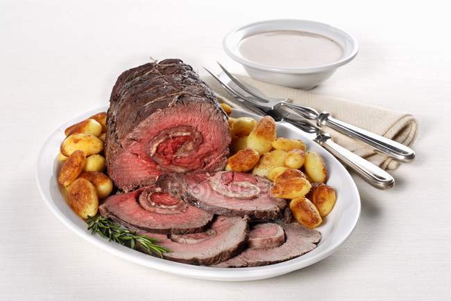Rolled roasted beef with ham filling — Stock Photo