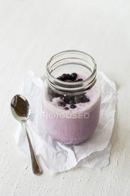 Blueberry milkshake in glass — Stock Photo