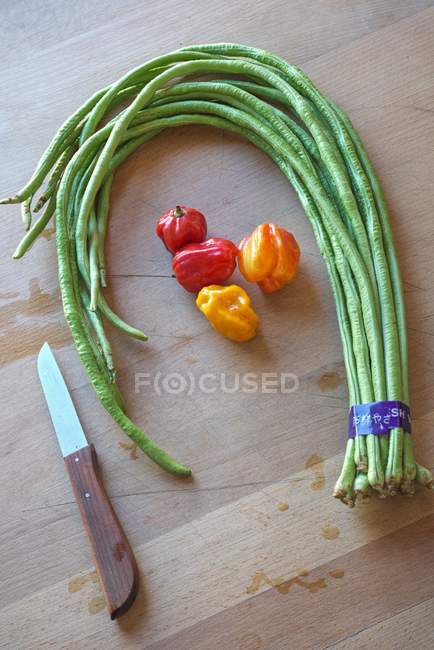 Asparagus beans and chilli peppers — Stock Photo