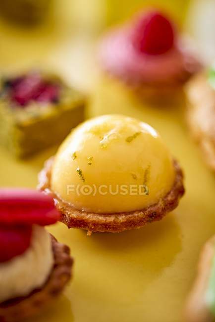Petit fours at a wedding buffet on blured background — Stock Photo