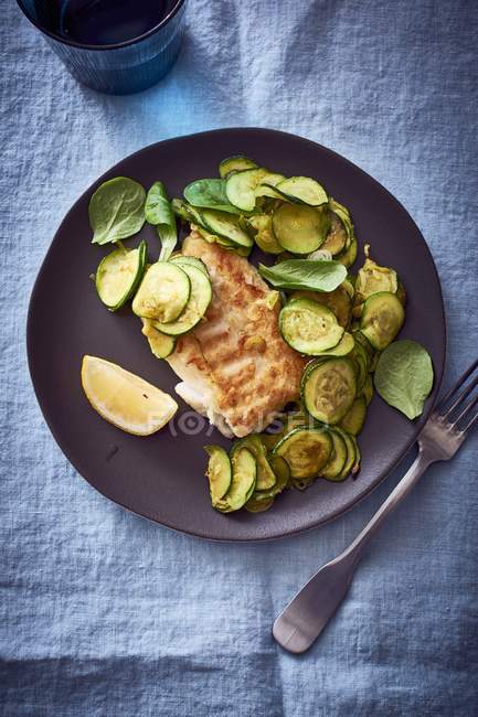 Pan-fried cod with courgette — Stock Photo