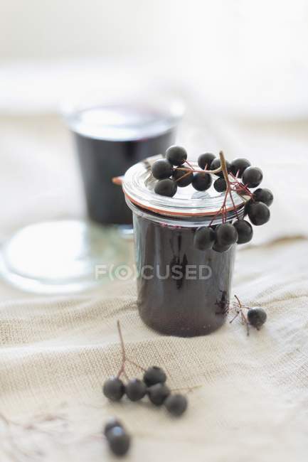 Homemade aronia berry jelly in jars — Stock Photo