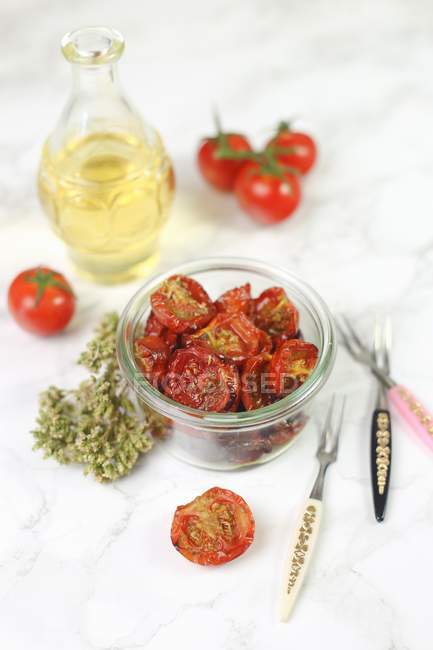 Confit tomatoes in glass — Stock Photo
