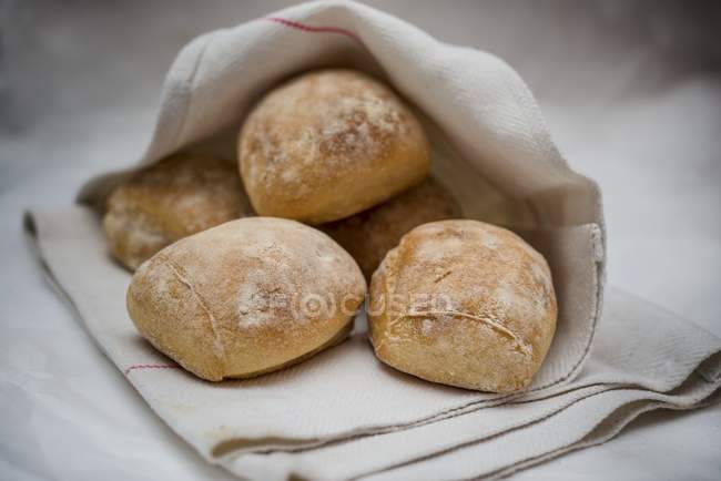Bread rolls in towel — Stock Photo