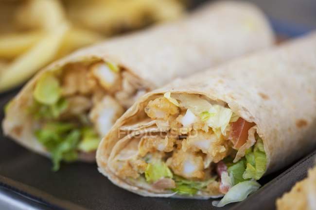 Closeup view of two wraps with fried calamari and lettuce — Stock Photo
