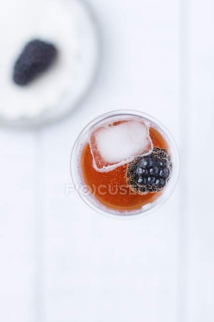 Kir cocktail with a blackberry — Stock Photo