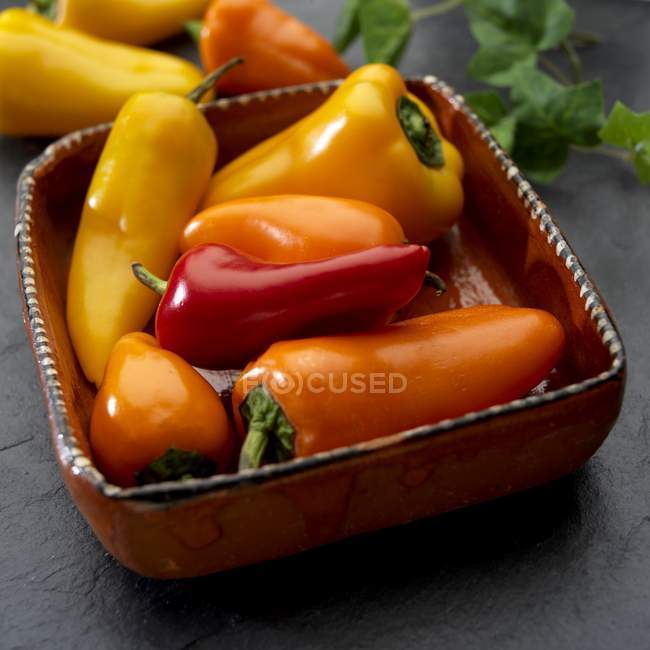 Yellow with red and orange peppers — Stock Photo