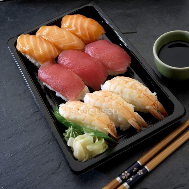 Nigiri sushi with salmon, tuna and prawns — Stock Photo