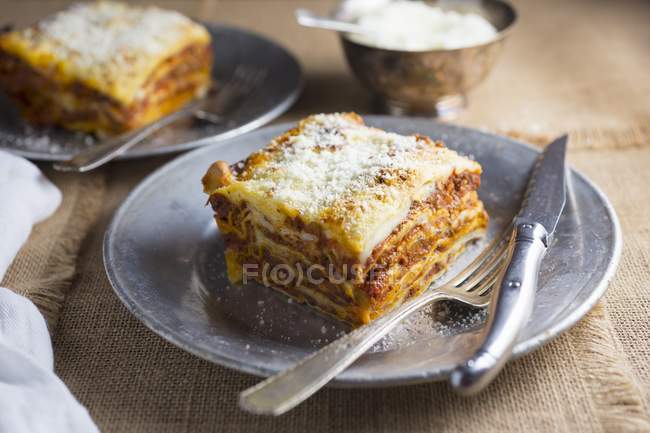 Lasagna with minced meat and grated cheese — Stock Photo