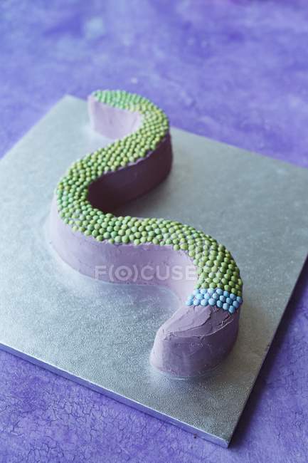Snake cake for a children party — Stock Photo