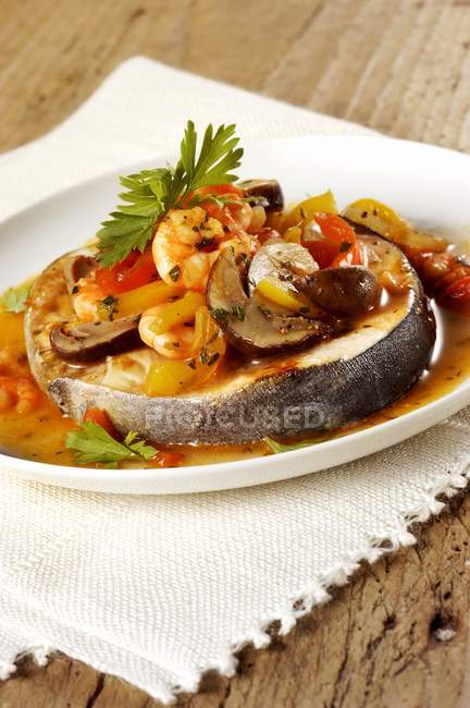Swordfish with prawns and mushroom sauce — Stock Photo