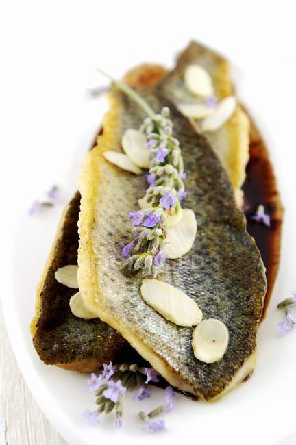 Trout in sauce with almonds — Stock Photo
