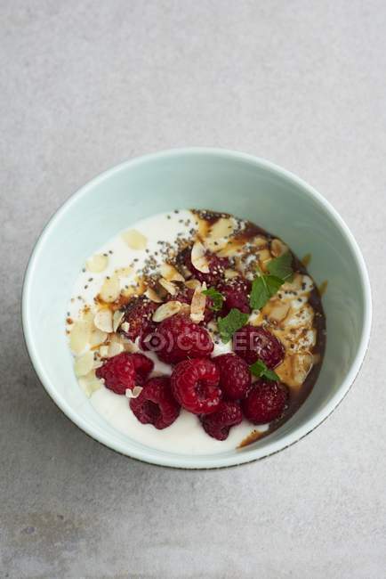 Yoghurt and raspberries muesli — Stock Photo