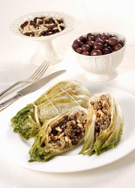 Closeup view of stuffed endives with olives, raisins and pine nuts — Stock Photo