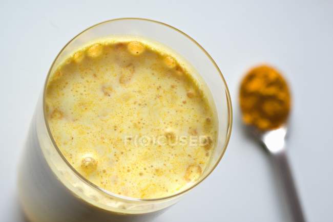 Golden milk in glass — Stock Photo