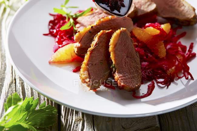 Duck breast with orange fillets — Stock Photo