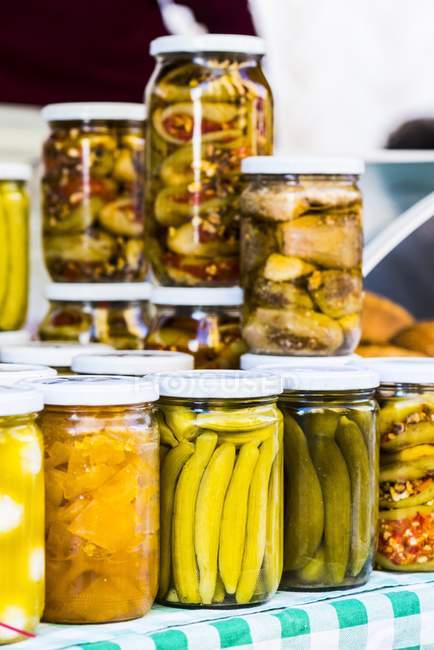 Closeup view of pickled vegetables in glass jars — Stock Photo