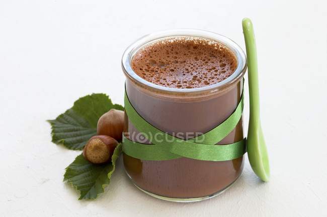 Closeup view of chocolate and hazelnut Flan in glass — Stock Photo