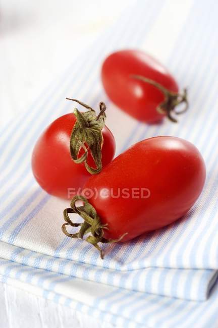 Three date tomatoes — Stock Photo