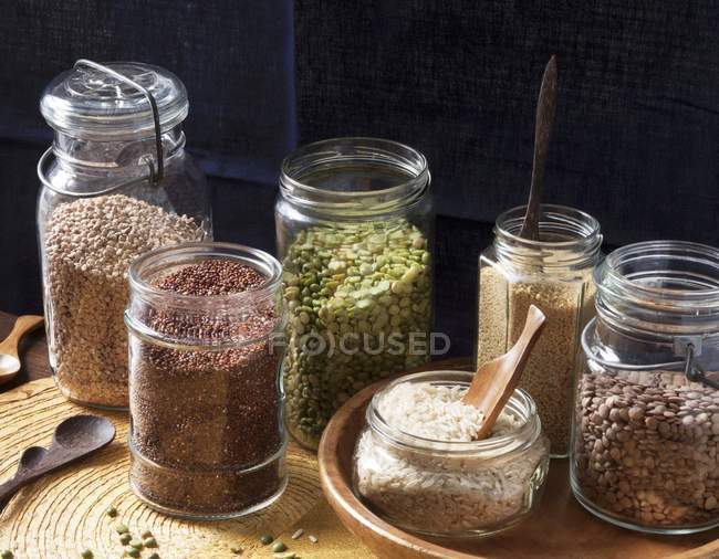 Different grain agricultures in jars — Stock Photo