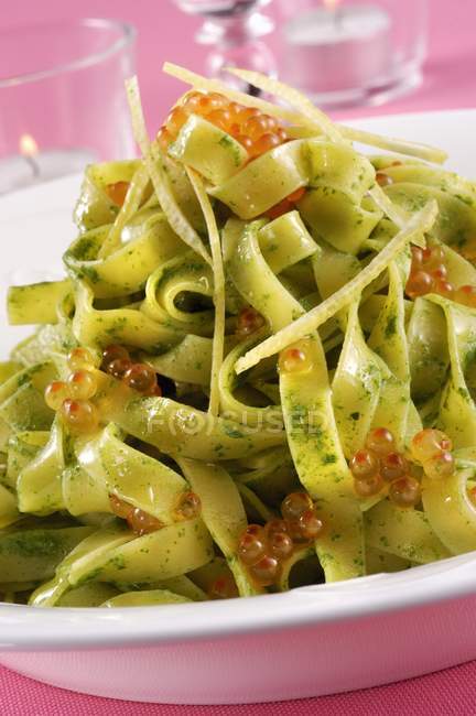 Tagliatelle pasta with pesto and caviar — Stock Photo