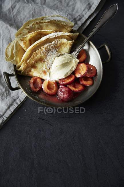 Pancakes with plum compote — Stock Photo