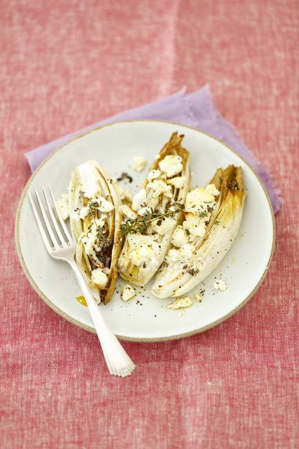 Chicory baked with feta — Stock Photo