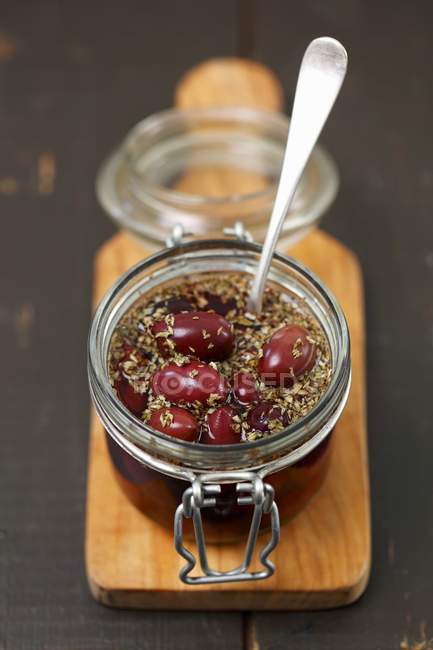 Pickled kalamata olives with oregano — Stock Photo