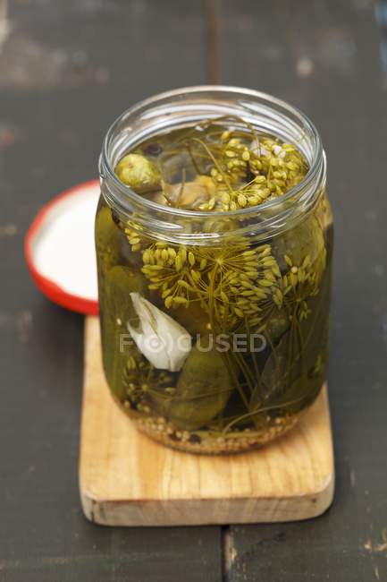 Pickled Gherkins in glass jar — Stock Photo